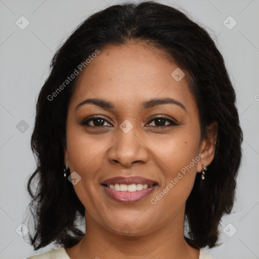 Joyful latino adult female with medium  brown hair and brown eyes