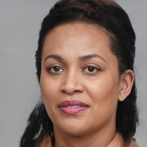 Joyful black young-adult female with medium  black hair and brown eyes