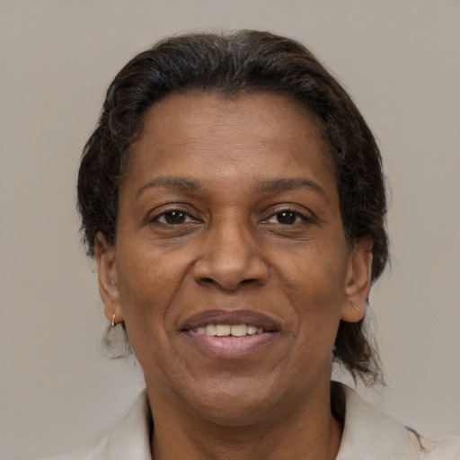 Joyful latino adult female with medium  brown hair and brown eyes