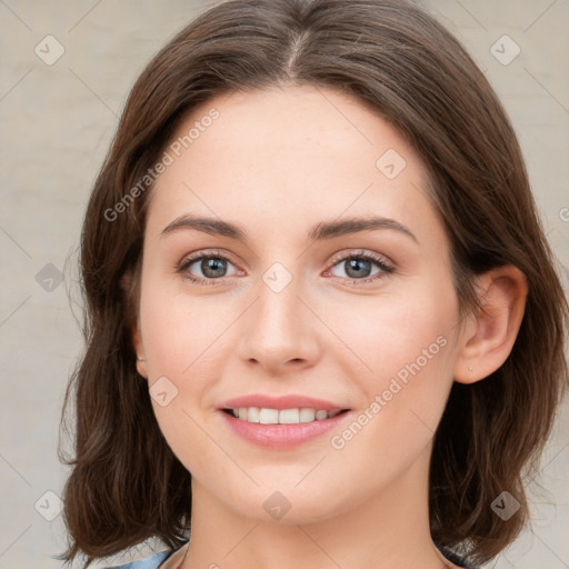 Joyful white young-adult female with medium  brown hair and green eyes