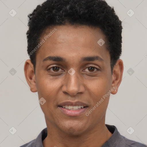 Joyful black young-adult male with short  black hair and brown eyes