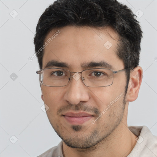 Joyful white young-adult male with short  black hair and brown eyes