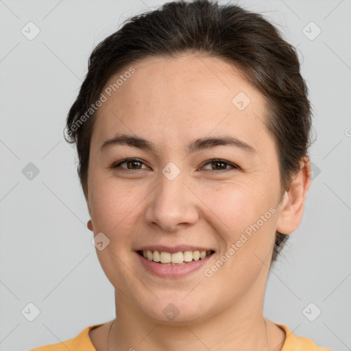 Joyful white young-adult female with short  brown hair and brown eyes