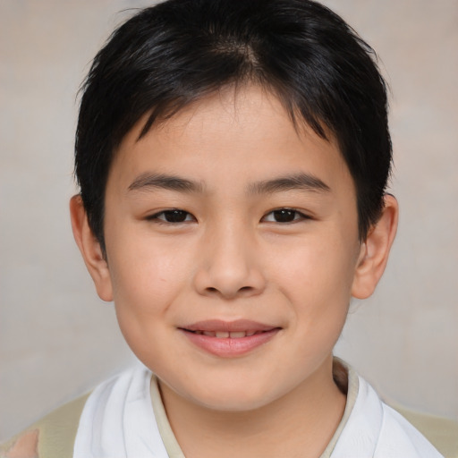 Joyful asian child male with short  brown hair and brown eyes