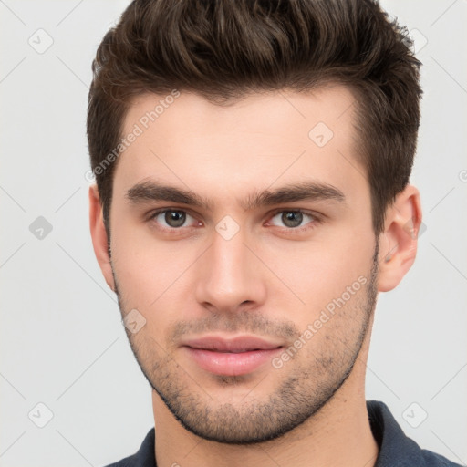 Neutral white young-adult male with short  brown hair and brown eyes