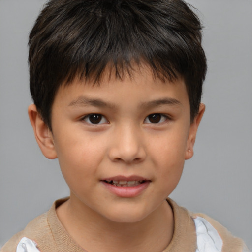Joyful white child male with short  brown hair and brown eyes