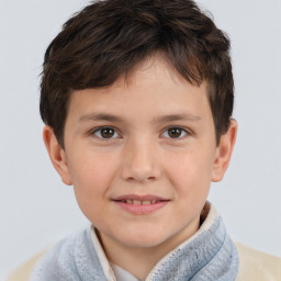 Joyful white child male with short  brown hair and brown eyes