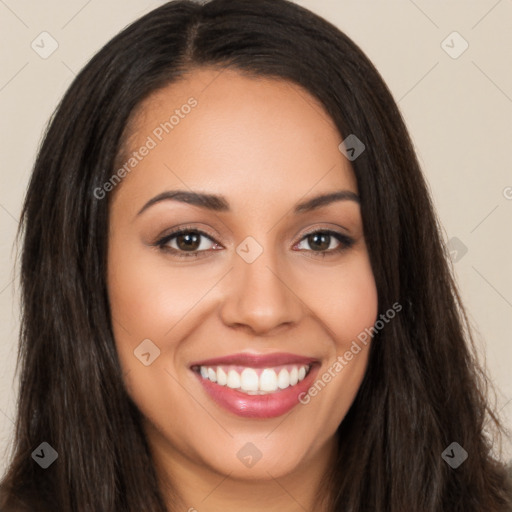 Joyful latino young-adult female with long  brown hair and brown eyes