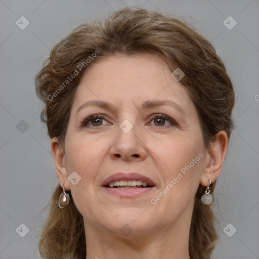 Joyful white adult female with medium  brown hair and grey eyes