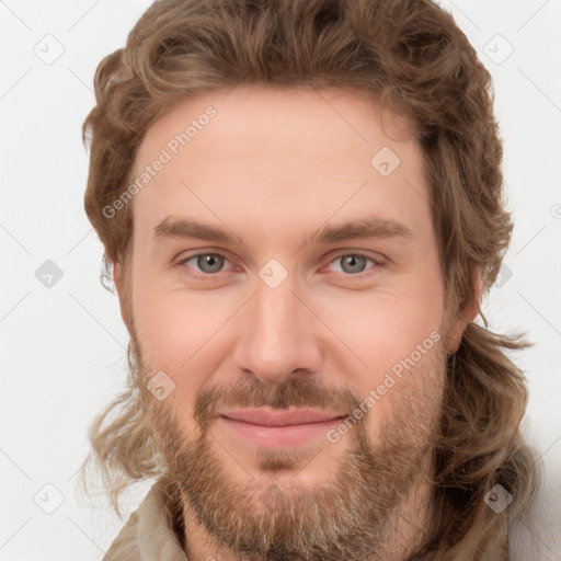 Joyful white young-adult male with short  brown hair and green eyes