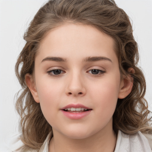 Joyful white child female with medium  brown hair and brown eyes