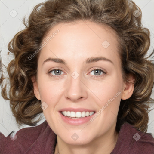 Joyful white young-adult female with medium  brown hair and green eyes