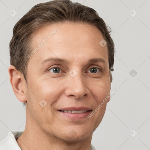 Joyful white adult female with short  brown hair and grey eyes