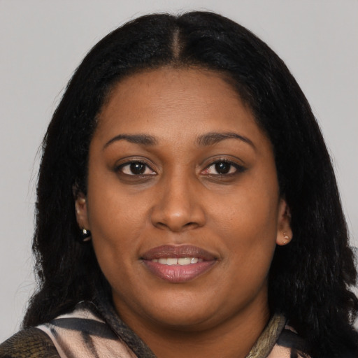 Joyful latino young-adult female with medium  black hair and brown eyes