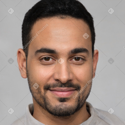 Joyful latino young-adult male with short  black hair and brown eyes