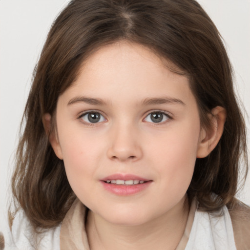 Joyful white child female with medium  brown hair and brown eyes