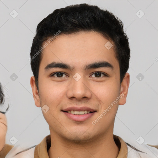 Joyful latino young-adult male with short  brown hair and brown eyes