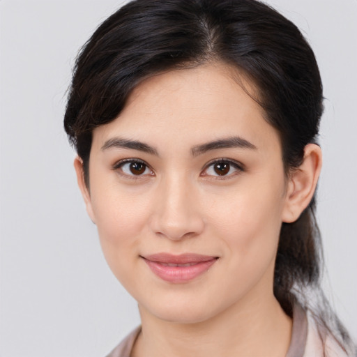 Joyful white young-adult female with medium  brown hair and brown eyes