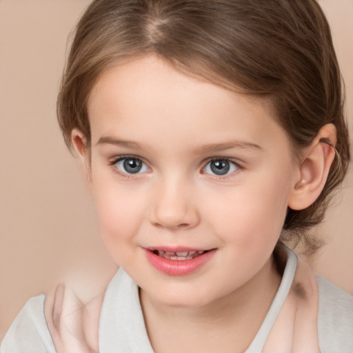 Joyful white child female with medium  brown hair and brown eyes