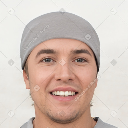 Joyful white young-adult male with short  black hair and brown eyes