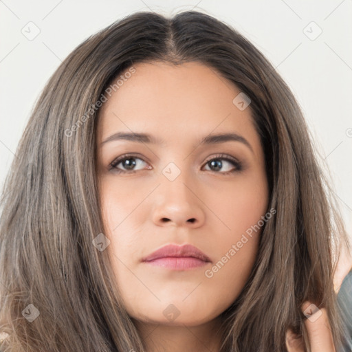 Neutral white young-adult female with long  brown hair and brown eyes