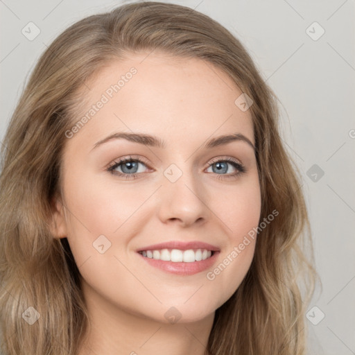 Joyful white young-adult female with long  brown hair and green eyes