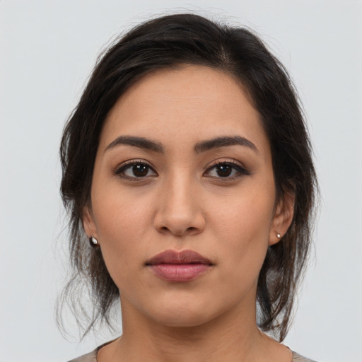Neutral latino young-adult female with medium  brown hair and brown eyes