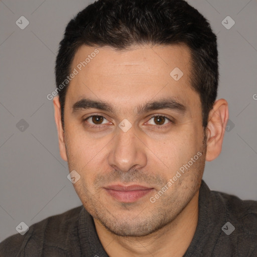 Joyful white adult male with short  brown hair and brown eyes