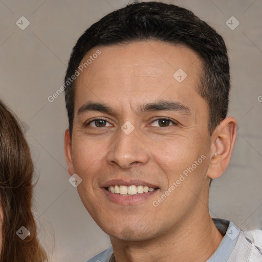 Joyful white adult male with short  brown hair and brown eyes