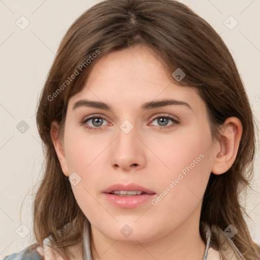 Neutral white young-adult female with long  brown hair and brown eyes