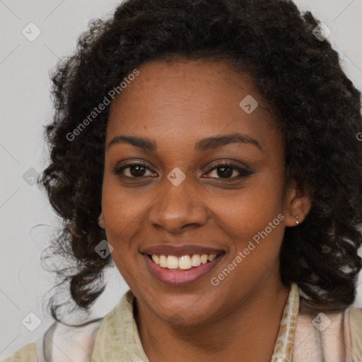 Joyful black young-adult female with long  brown hair and brown eyes