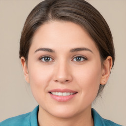 Joyful white young-adult female with medium  brown hair and brown eyes