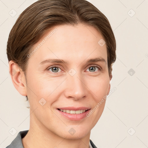 Joyful white young-adult female with short  brown hair and grey eyes