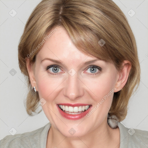 Joyful white young-adult female with medium  brown hair and blue eyes