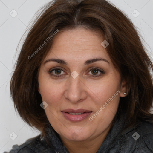 Joyful white adult female with medium  brown hair and brown eyes