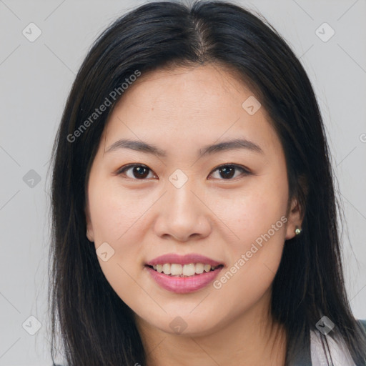 Joyful asian young-adult female with long  brown hair and brown eyes