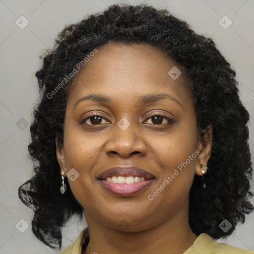 Joyful black young-adult female with medium  brown hair and brown eyes