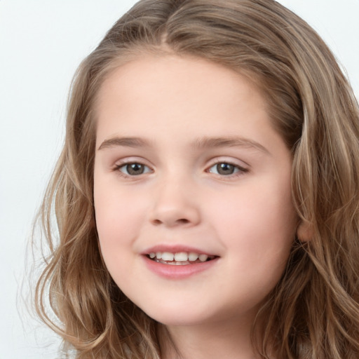 Joyful white child female with long  brown hair and brown eyes