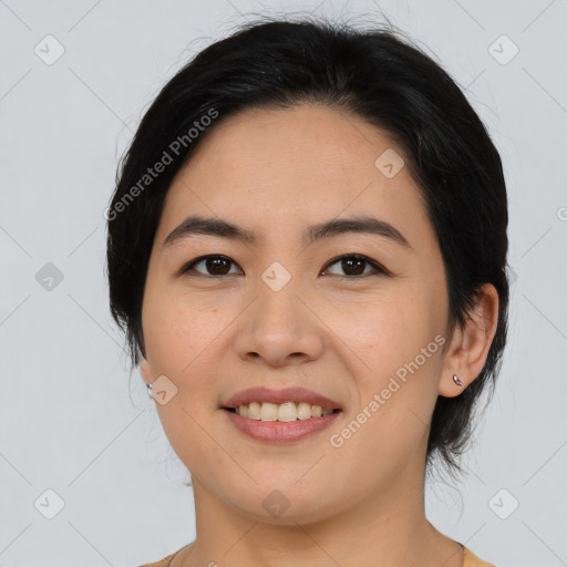 Joyful asian young-adult female with medium  black hair and brown eyes