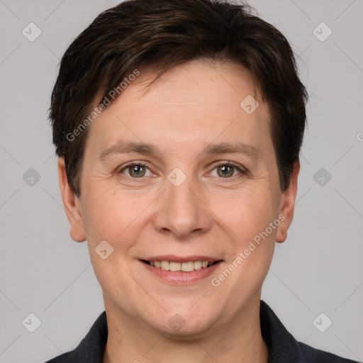 Joyful white adult female with short  brown hair and grey eyes