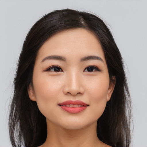 Joyful asian young-adult female with medium  black hair and brown eyes