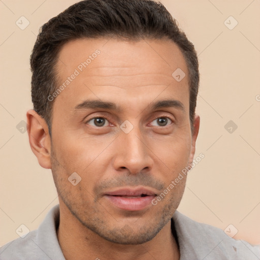 Joyful white adult male with short  brown hair and brown eyes