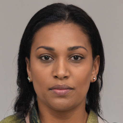 Joyful black young-adult female with medium  black hair and brown eyes