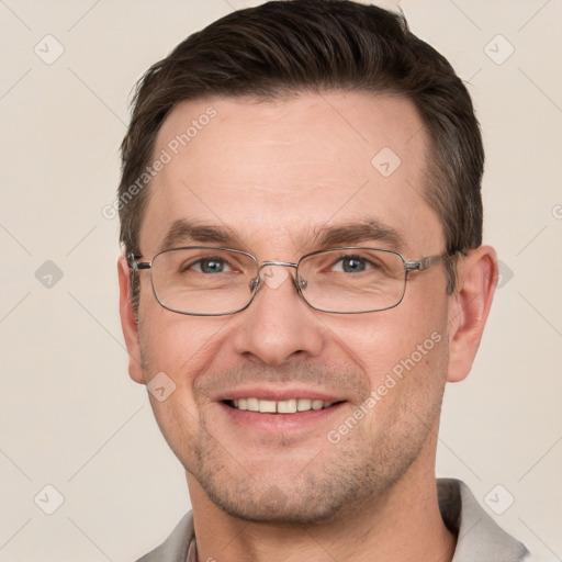 Joyful white adult male with short  brown hair and grey eyes