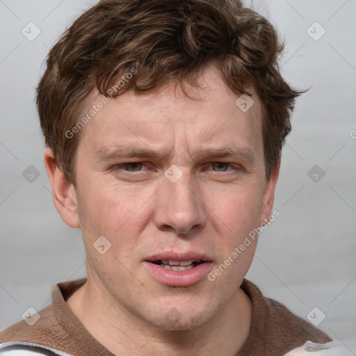 Joyful white adult male with short  brown hair and grey eyes