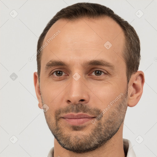 Neutral white young-adult male with short  brown hair and brown eyes