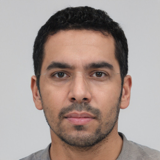 Neutral white young-adult male with short  black hair and brown eyes