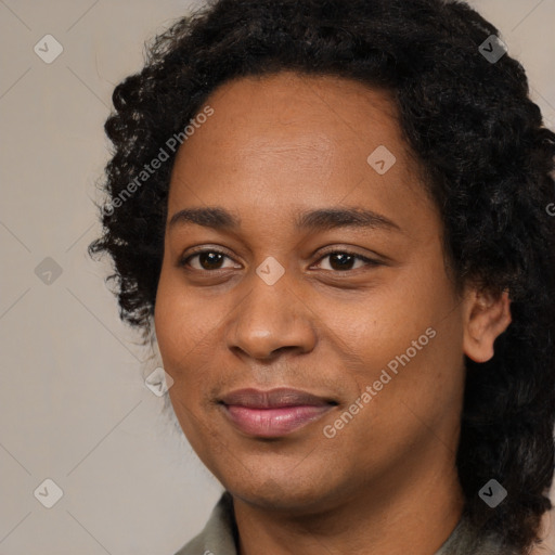 Joyful black young-adult female with long  black hair and brown eyes