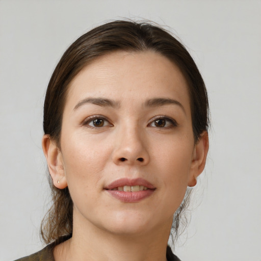 Joyful white young-adult female with medium  brown hair and brown eyes