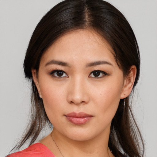 Neutral asian young-adult female with medium  brown hair and brown eyes